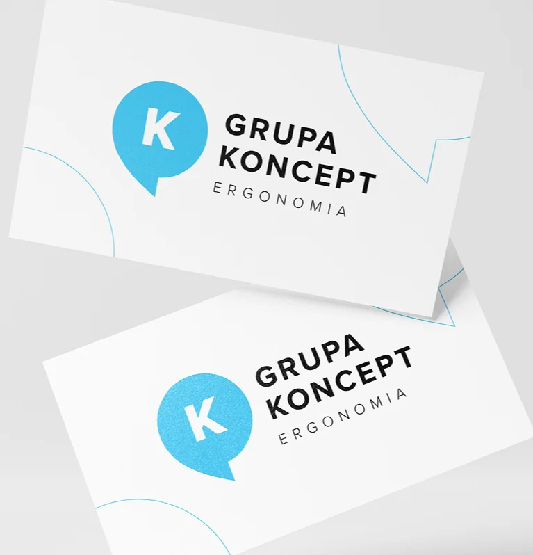 Logo Grupy Koncept – błękitny dymek z literą K i napis Grupa Koncept Ergonomia, na kartach papieru